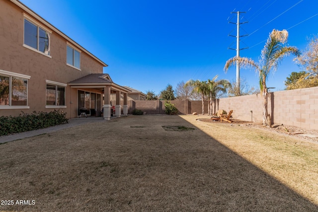 view of yard with a fenced backyard