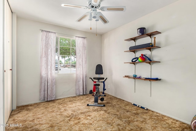 workout room with carpet floors, ceiling fan, and baseboards