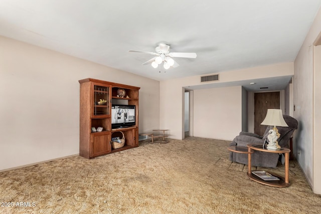 sitting room featuring carpet flooring and ceiling fan