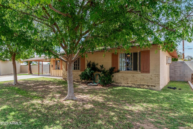 single story home with a carport and driveway