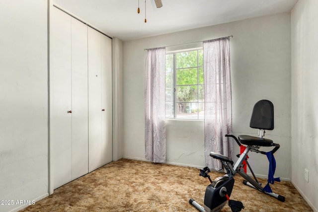 workout area featuring carpet, ceiling fan, and baseboards