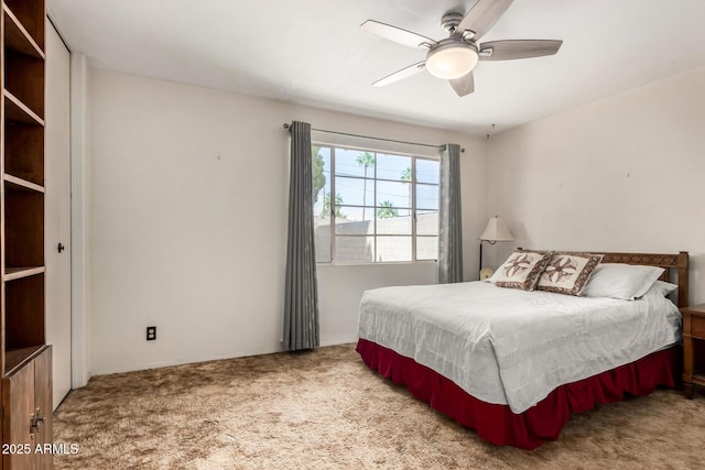 carpeted bedroom with a ceiling fan