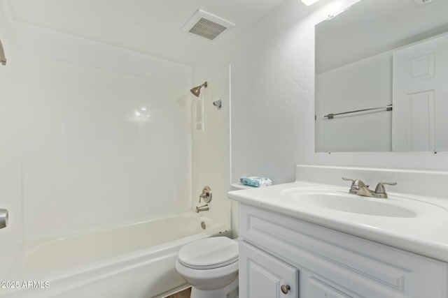 full bathroom featuring toilet, vanity, and tub / shower combination