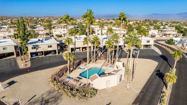 birds eye view of property with a mountain view