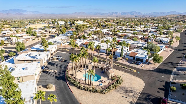 birds eye view of property with a mountain view