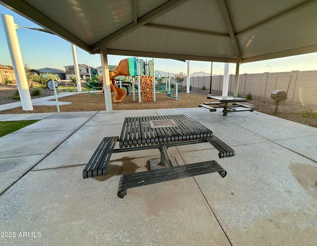 view of patio with a grill and a playground