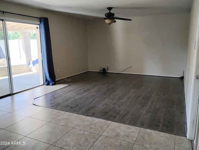 empty room with ceiling fan and light wood-type flooring