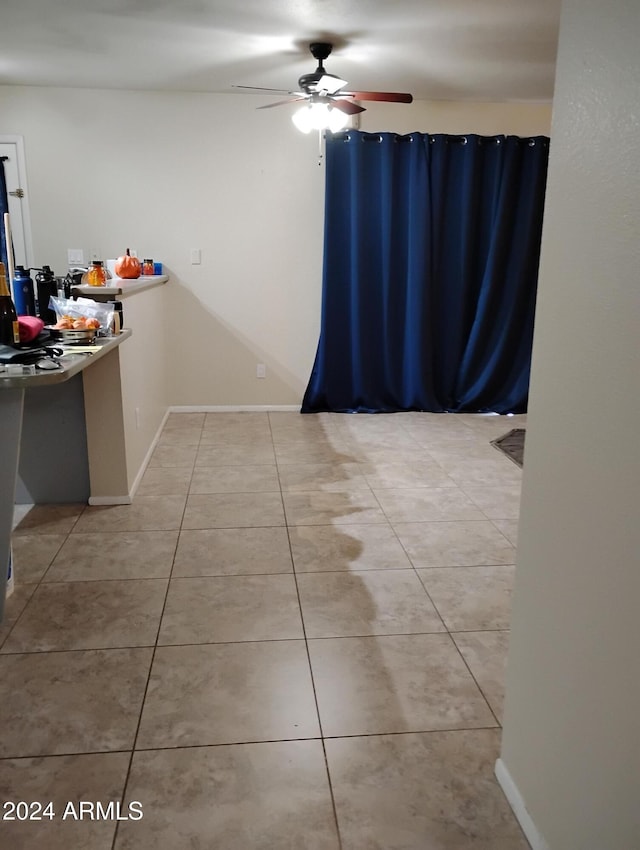 bathroom featuring tile patterned flooring and ceiling fan