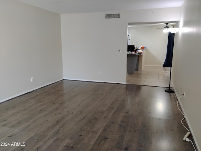 spare room with ceiling fan and light hardwood / wood-style floors