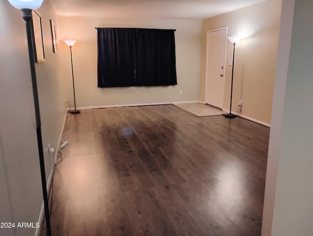 empty room with hardwood / wood-style flooring