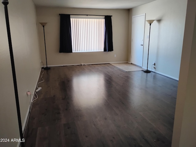 unfurnished room with hardwood / wood-style flooring