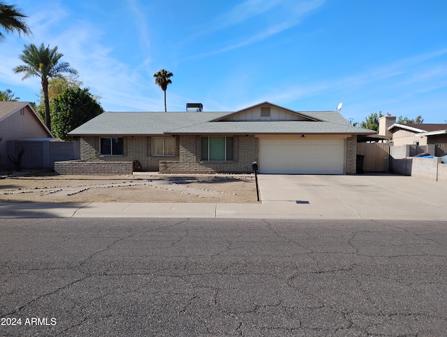 single story home featuring a garage