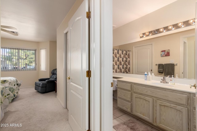 bathroom with tile patterned floors and vanity