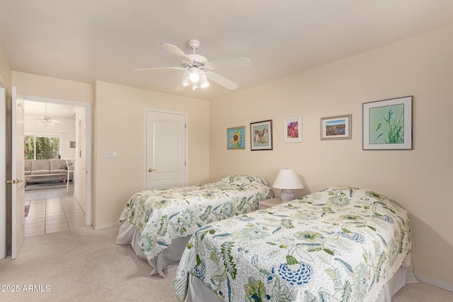 bedroom featuring light carpet and ceiling fan