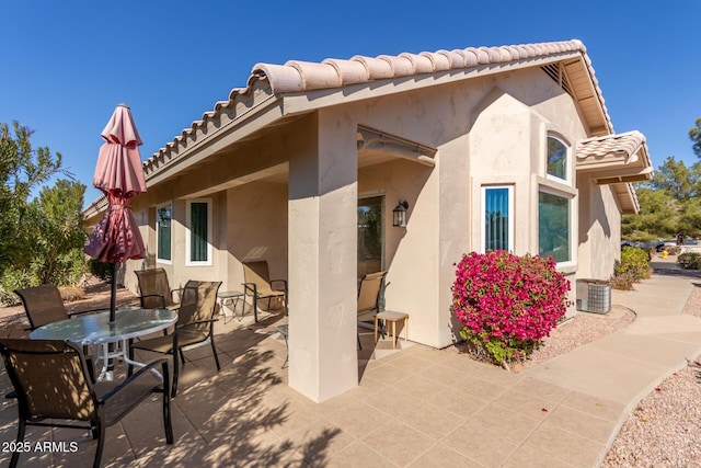 back of property featuring a patio area