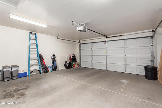 garage featuring a garage door opener