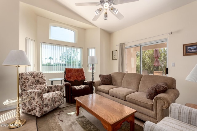 living room featuring vaulted ceiling, hardwood / wood-style floors, and ceiling fan