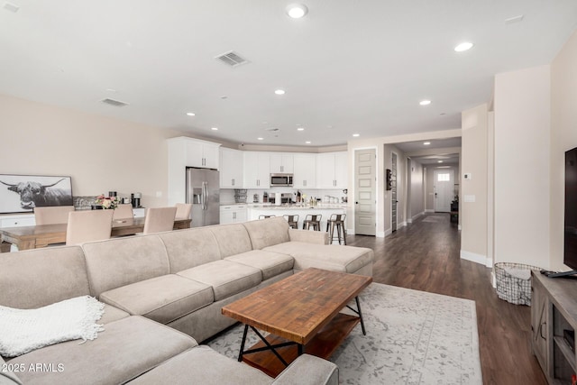 living room with dark wood-type flooring