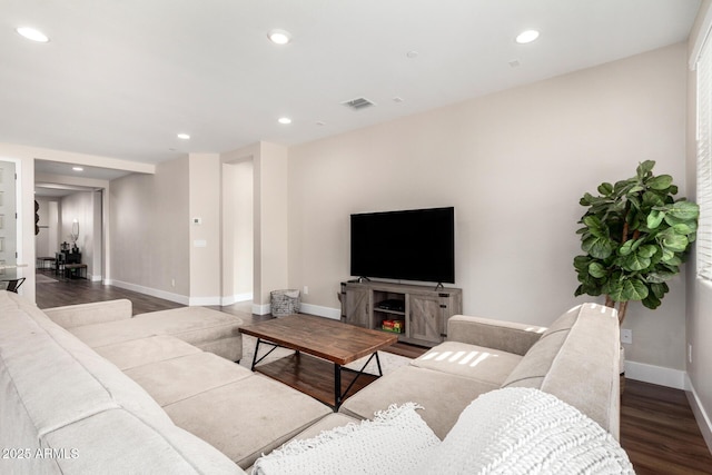 living room featuring dark hardwood / wood-style flooring