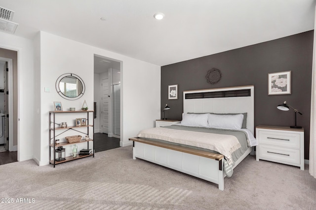 bedroom featuring light colored carpet