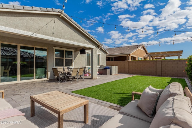 exterior space with an outdoor hangout area and a patio area