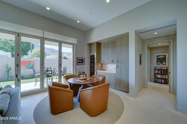 dining space featuring a mountain view and a healthy amount of sunlight