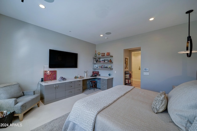 carpeted bedroom featuring built in desk