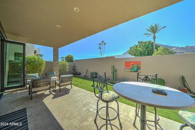 view of patio / terrace featuring a mountain view