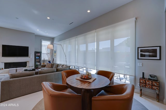 dining area with light tile patterned flooring