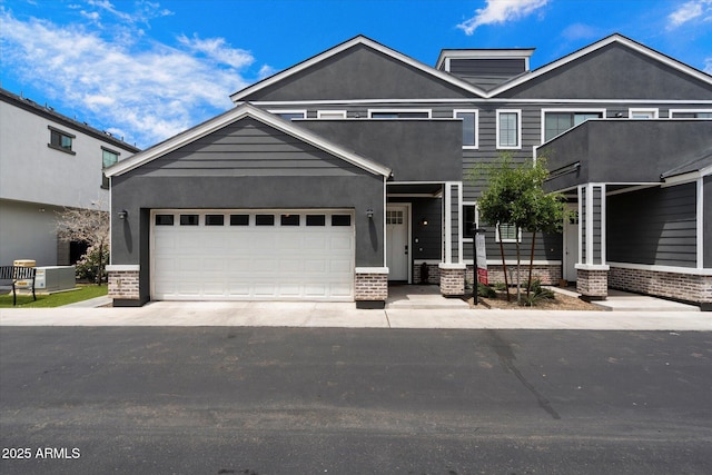 2604 N 27th St Unit 4, Phoenix, AZ 85008 - view of front of home featuring brick siding, driveway, and stucco siding