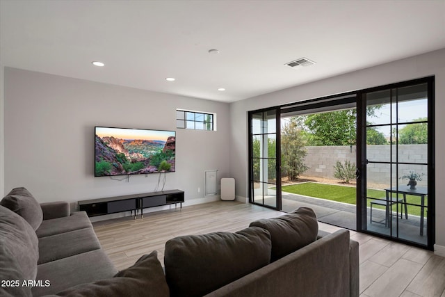 2604 N 27th St Unit 4, Phoenix, AZ 85008 - living room with baseboards, recessed lighting, and light wood-style floors
