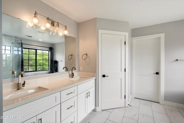 2604 N 27th St Unit 4, Phoenix, AZ 85008 - full bathroom featuring double vanity, marble look tiles, baseboards, and an enclosed shower