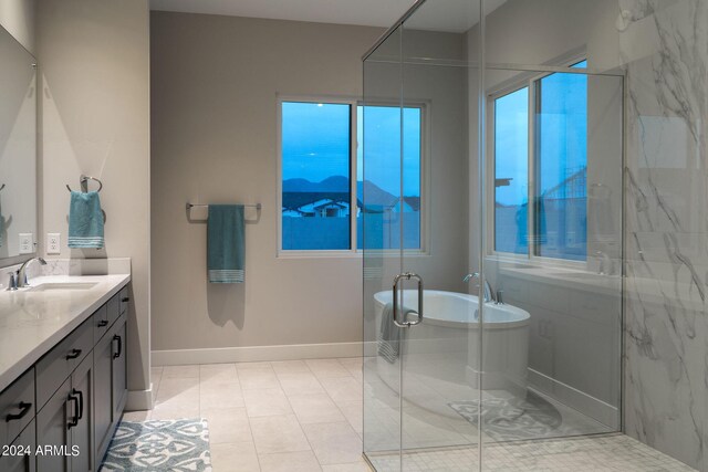 bathroom featuring tile patterned flooring, vanity, and an enclosed shower