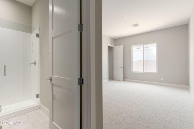 bathroom featuring an enclosed shower