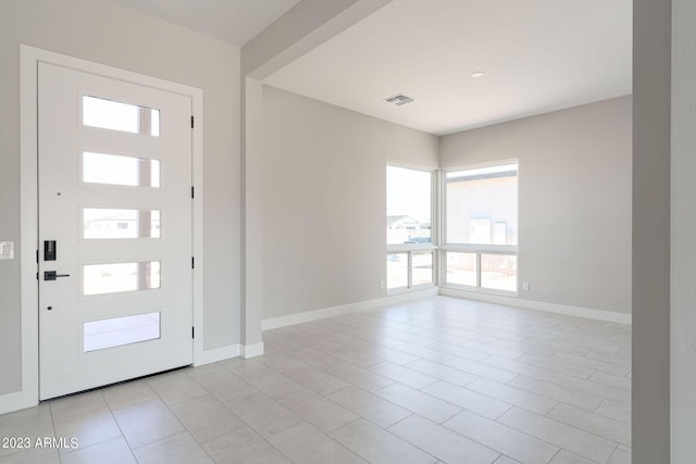 foyer featuring light tile patterned flooring