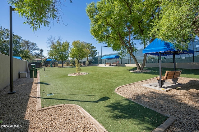 view of property's community with a lawn