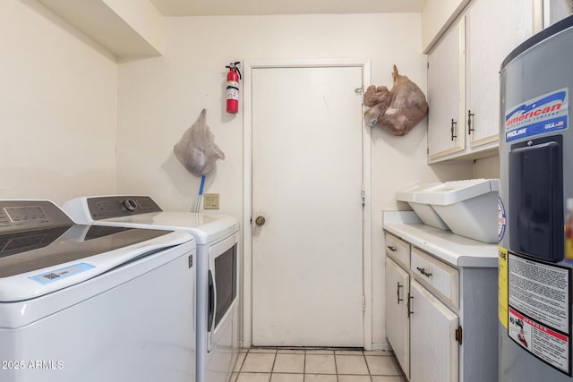 laundry area with cabinets, independent washer and dryer, and light tile patterned floors