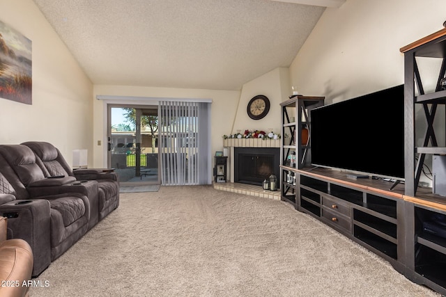 carpeted living room with vaulted ceiling, a brick fireplace, and a textured ceiling