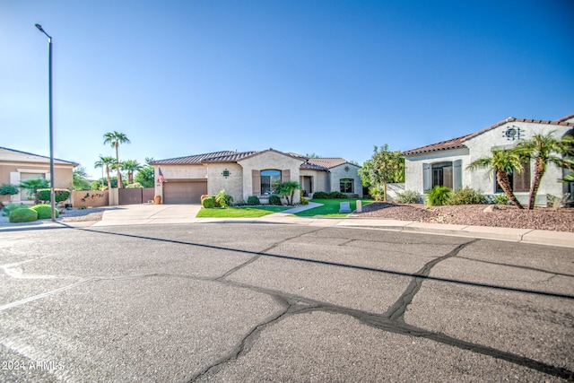 mediterranean / spanish house featuring a garage