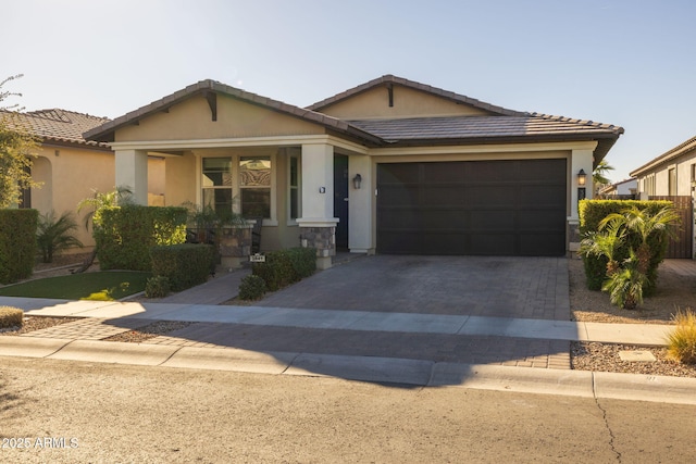 ranch-style house featuring a garage