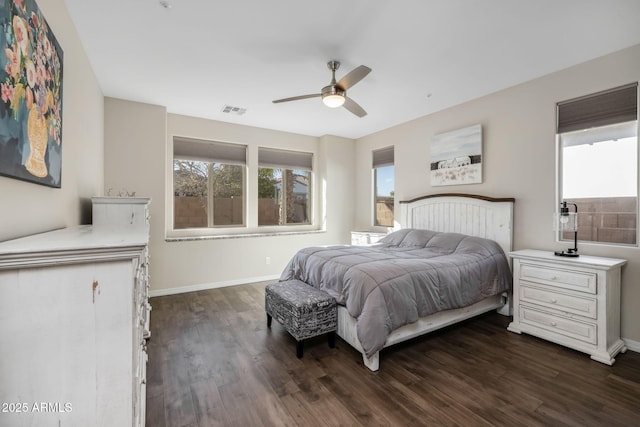 bedroom with dark wood-type flooring and ceiling fan