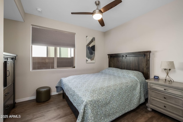 bedroom with hardwood / wood-style flooring and ceiling fan