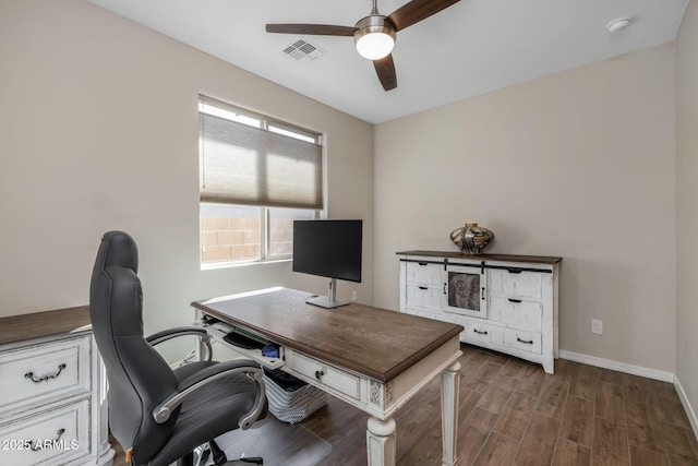 office area with dark hardwood / wood-style floors and ceiling fan