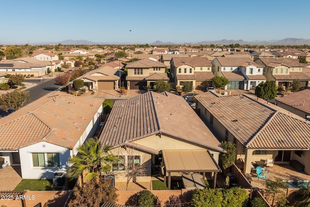 birds eye view of property with a mountain view