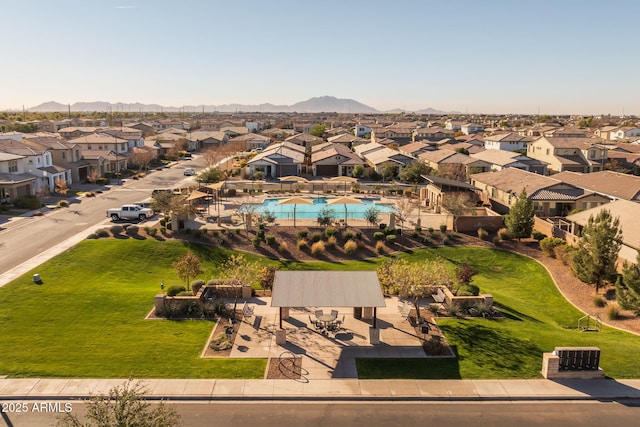 birds eye view of property with a mountain view