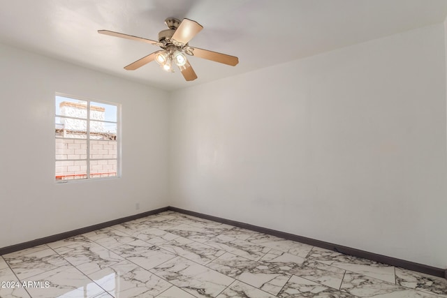 spare room with ceiling fan