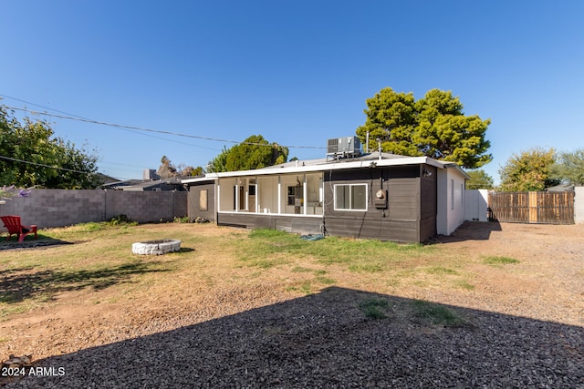 back of property featuring a porch and central AC