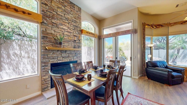 dining space featuring visible vents, baseboards, and light wood-style floors