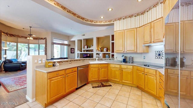 kitchen with stainless steel dishwasher, light countertops, black electric cooktop, a sink, and open floor plan