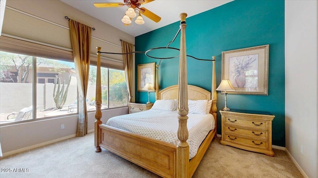 carpeted bedroom featuring baseboards